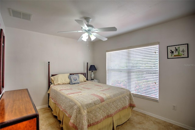 bedroom with baseboards, ceiling fan, and visible vents