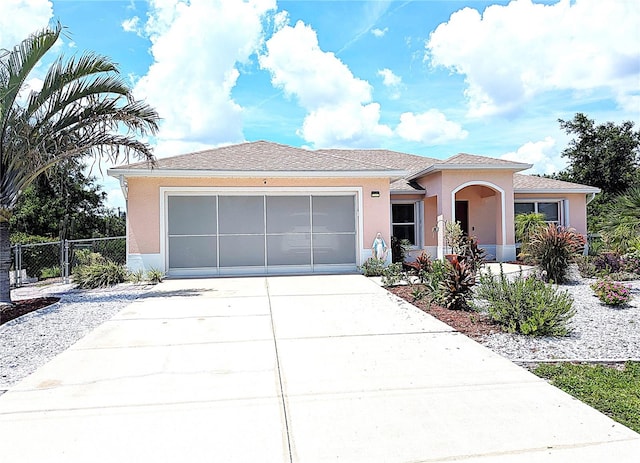 10064 Cocoa Beach St, Port Charlotte, FL 33981 - single story home with stucco siding, concrete driveway, and a garage