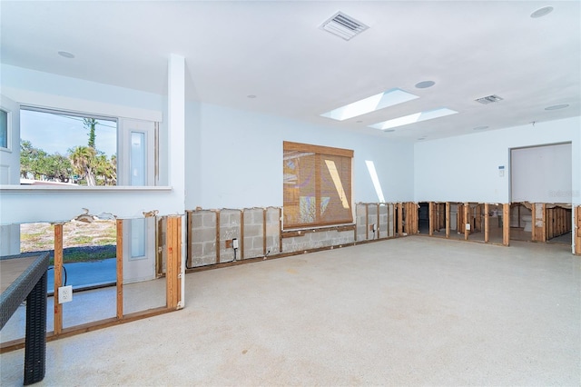 4093 Pelican Shores Cir, Englewood, FL 34223 - miscellaneous room with a skylight and carpet flooring