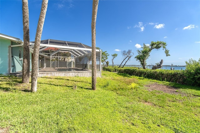 4093 Pelican Shores Cir, Englewood, FL 34223 - view of green lawn with a lanai and a water view