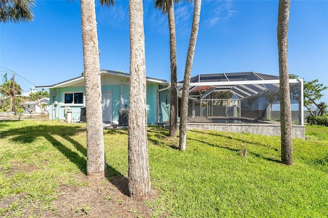 4093 Pelican Shores Cir, Englewood, FL 34223 - view of grassy yard with a lanai