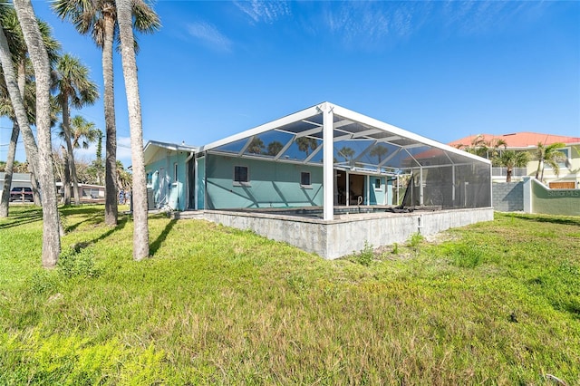 4093 Pelican Shores Cir, Englewood, FL 34223 - rear view of house with a yard and a lanai