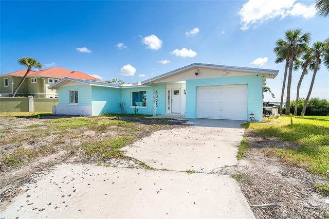 4093 Pelican Shores Cir, Englewood, FL 34223 - view of front facade featuring concrete driveway, a garage, and fence