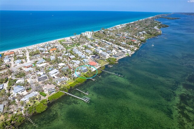 4093 Pelican Shores Cir, Englewood, FL 34223 - aerial view of property and surrounding area featuring waterfront with a beach and nearby suburban area