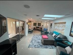 4093 Pelican Shores Cir, Englewood, FL 34223 - living area featuring healthy amount of natural light