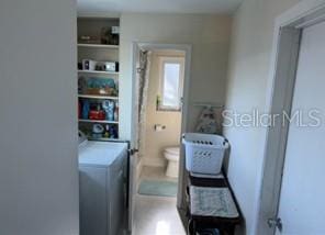 4093 Pelican Shores Cir, Englewood, FL 34223 - clothes washing area featuring washing machine and dryer