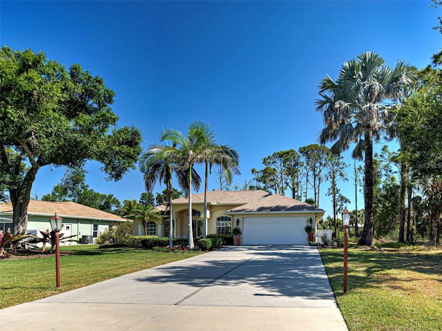 237 Rotonda Blvd E, Rotonda West, FL 33947 - ranch-style home featuring an attached garage, concrete driveway, a front lawn, and stucco siding