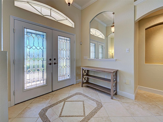 237 Rotonda Blvd E, Rotonda West, FL 33947 - entrance foyer with ornamental molding, healthy amount of natural light, french doors, baseboards, and arched walkways