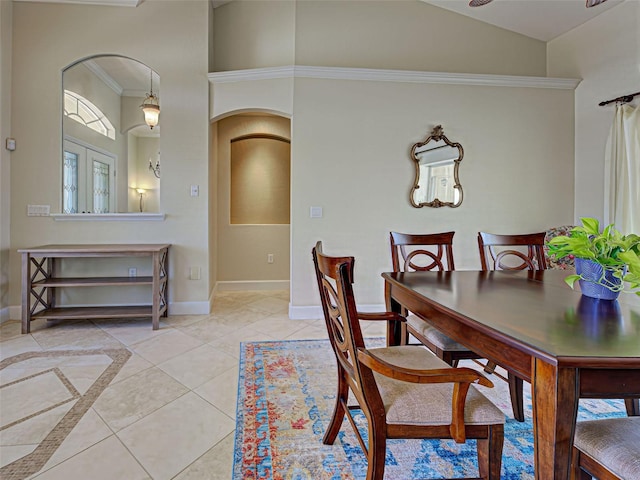 237 Rotonda Blvd E, Rotonda West, FL 33947 - dining room with arched walkways, baseboards, light tile patterned flooring, ornamental molding, and high vaulted ceiling