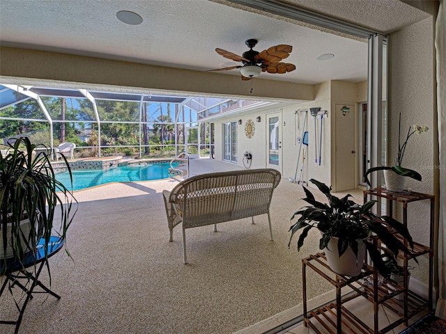 237 Rotonda Blvd E, Rotonda West, FL 33947 - outdoor pool featuring a patio area, ceiling fan, and glass enclosure