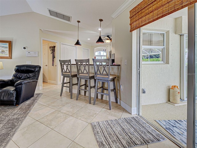 237 Rotonda Blvd E, Rotonda West, FL 33947 - kitchen with a kitchen bar, decorative light fixtures, crown molding, vaulted ceiling, and open floor plan