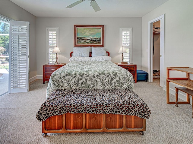 237 Rotonda Blvd E, Rotonda West, FL 33947 - bedroom with carpet, a spacious closet, ceiling fan, and baseboards