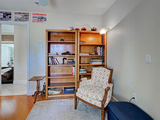 237 Rotonda Blvd E, Rotonda West, FL 33947 - living area with wood finished floors, baseboards, and a textured wall