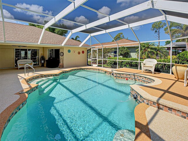 237 Rotonda Blvd E, Rotonda West, FL 33947 - outdoor pool featuring a patio and glass enclosure
