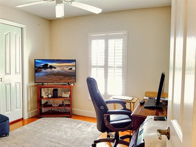 237 Rotonda Blvd E, Rotonda West, FL 33947 - office area with a ceiling fan, baseboards, and wood finished floors
