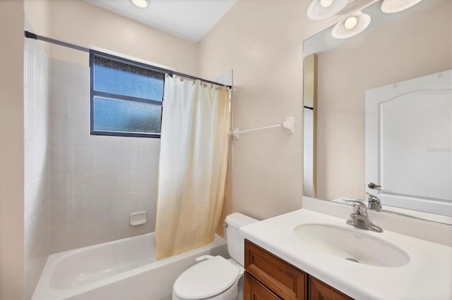 full bathroom featuring shower / bath combo with shower curtain, toilet, and vanity