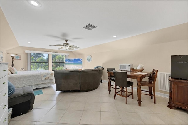dining area featuring ceiling fan, light tile patterned floors, recessed lighting, and lofted ceiling