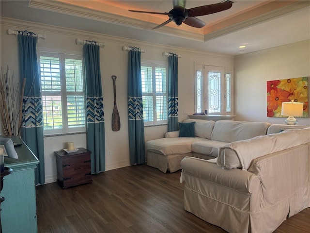 174 Broadmoor Ln, Rotonda West, FL 33947 - living area with plenty of natural light, a raised ceiling, ornamental molding, a ceiling fan, and dark wood-type flooring