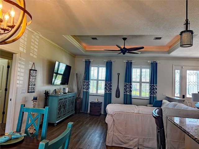 174 Broadmoor Ln, Rotonda West, FL 33947 - living room featuring a raised ceiling, crown molding, wood finished floors, a ceiling fan, and a textured ceiling