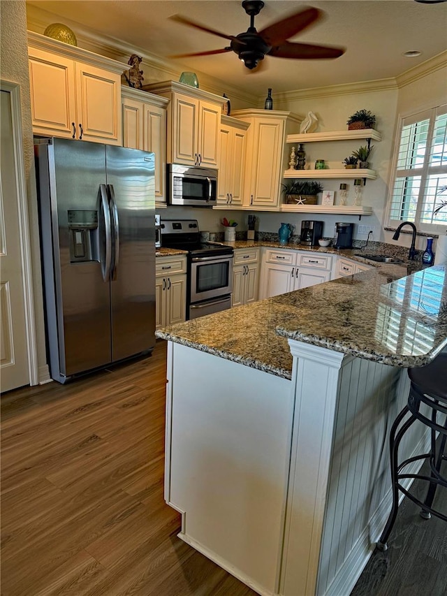 174 Broadmoor Ln, Rotonda West, FL 33947 - kitchen featuring appliances with stainless steel finishes, ornamental molding, open shelves, stone counters, and a ceiling fan
