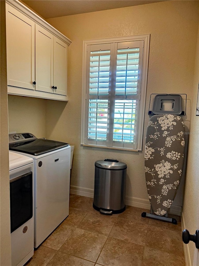 174 Broadmoor Ln, Rotonda West, FL 33947 - laundry room featuring washer and dryer and cabinet space