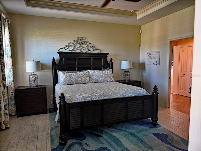 174 Broadmoor Ln, Rotonda West, FL 33947 - bedroom with wood finished floors and crown molding
