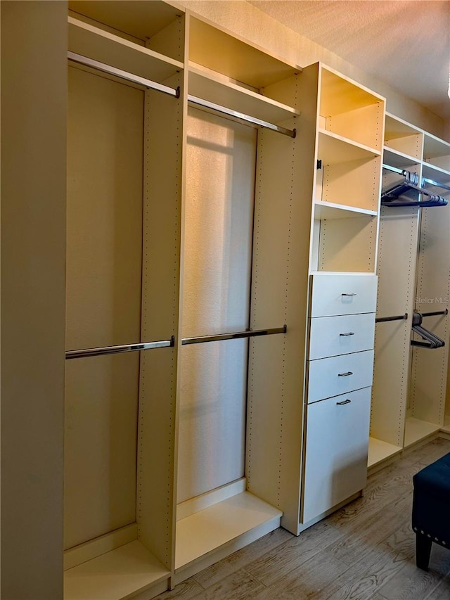 174 Broadmoor Ln, Rotonda West, FL 33947 - spacious closet featuring light wood-style flooring