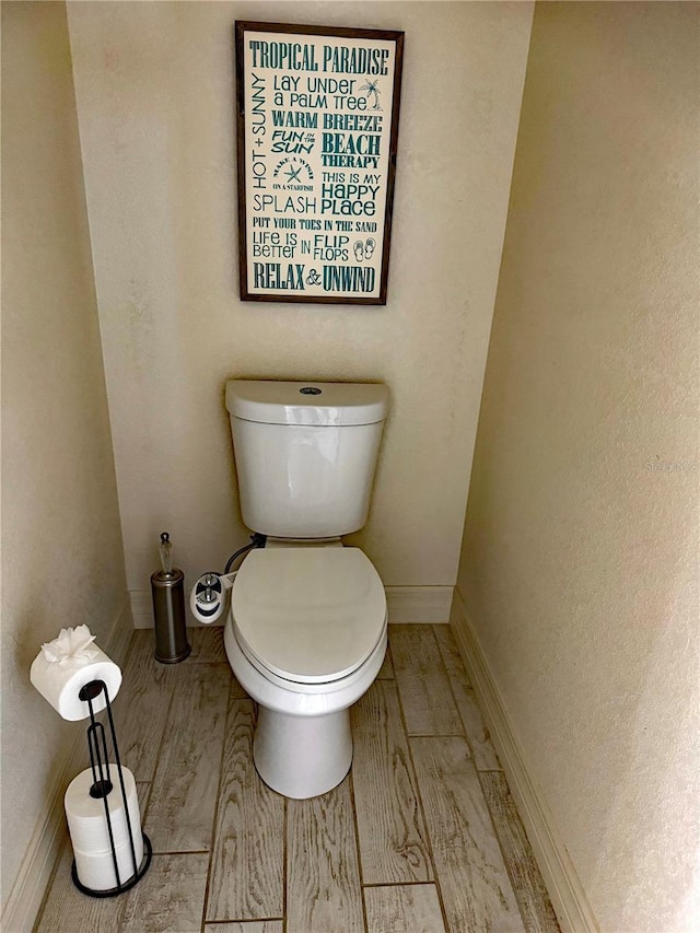 174 Broadmoor Ln, Rotonda West, FL 33947 - bathroom with toilet and baseboards