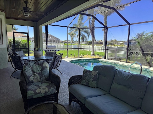 174 Broadmoor Ln, Rotonda West, FL 33947 - view of patio / terrace with a lanai, a ceiling fan, an outdoor hangout area, outdoor dining space, and grilling area
