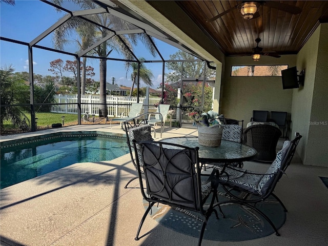 174 Broadmoor Ln, Rotonda West, FL 33947 - view of patio / terrace with an outdoor pool, ceiling fan, and glass enclosure