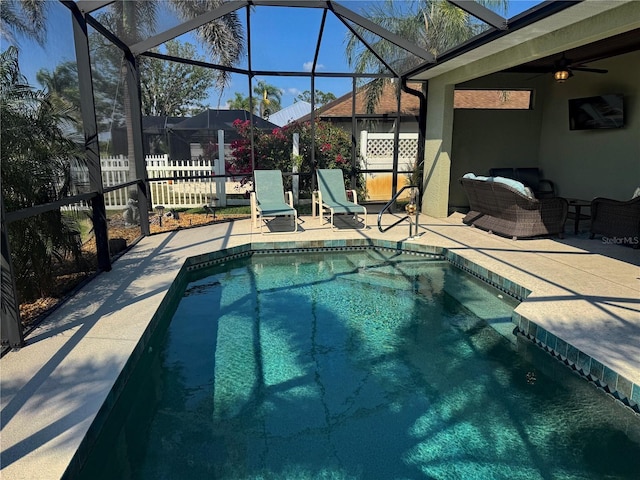 174 Broadmoor Ln, Rotonda West, FL 33947 - outdoor pool featuring a patio, glass enclosure, and a ceiling fan