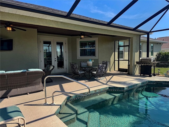 174 Broadmoor Ln, Rotonda West, FL 33947 - outdoor pool featuring french doors, a patio, area for grilling, a ceiling fan, and glass enclosure