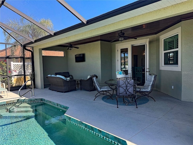 174 Broadmoor Ln, Rotonda West, FL 33947 - swimming pool with ceiling fan, a patio area, a lanai, and an outdoor hangout area