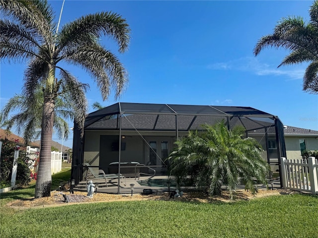 174 Broadmoor Ln, Rotonda West, FL 33947 - rear view of property with a patio, glass enclosure, stucco siding, and an outdoor pool