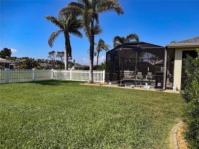 174 Broadmoor Ln, Rotonda West, FL 33947 - fenced backyard featuring a lanai and a patio area