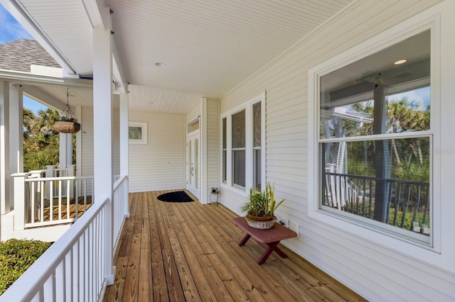 9144 Spring Valley Rd, Englewood, FL 34224 - wooden deck featuring a porch