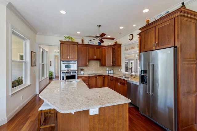 9144 Spring Valley Rd, Englewood, FL 34224 - kitchen with stainless steel appliances, a sink, ceiling fan, dark wood finished floors, and crown molding