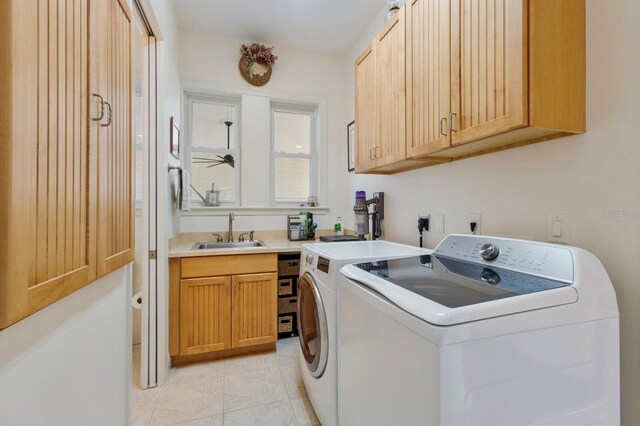 9144 Spring Valley Rd, Englewood, FL 34224 - washroom with cabinet space, separate washer and dryer, light tile patterned floors, and ceiling fan