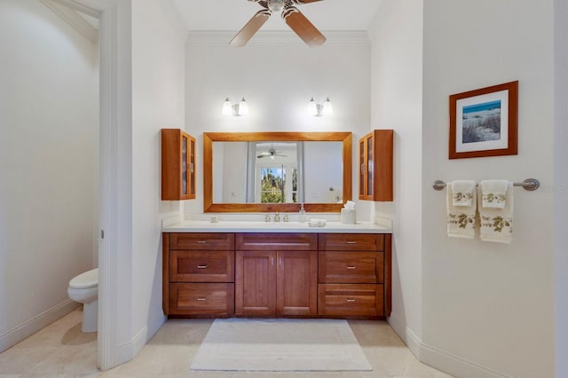 9144 Spring Valley Rd, Englewood, FL 34224 - full bathroom with a ceiling fan, toilet, vanity, crown molding, and baseboards