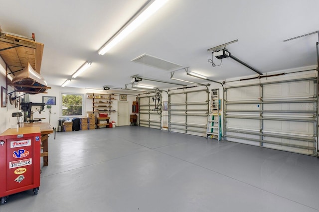 9144 Spring Valley Rd, Englewood, FL 34224 - garage featuring a garage door opener
