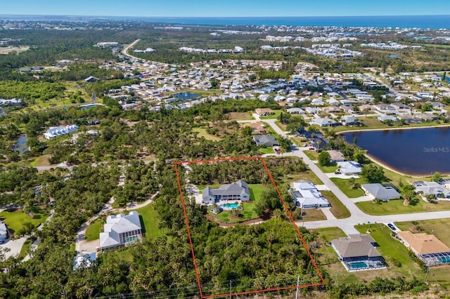 9144 Spring Valley Rd, Englewood, FL 34224 - aerial perspective of suburban area with property parcel outlined and a nearby body of water