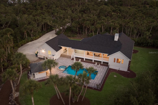 9144 Spring Valley Rd, Englewood, FL 34224 - view from above of property featuring a forest and a pool area