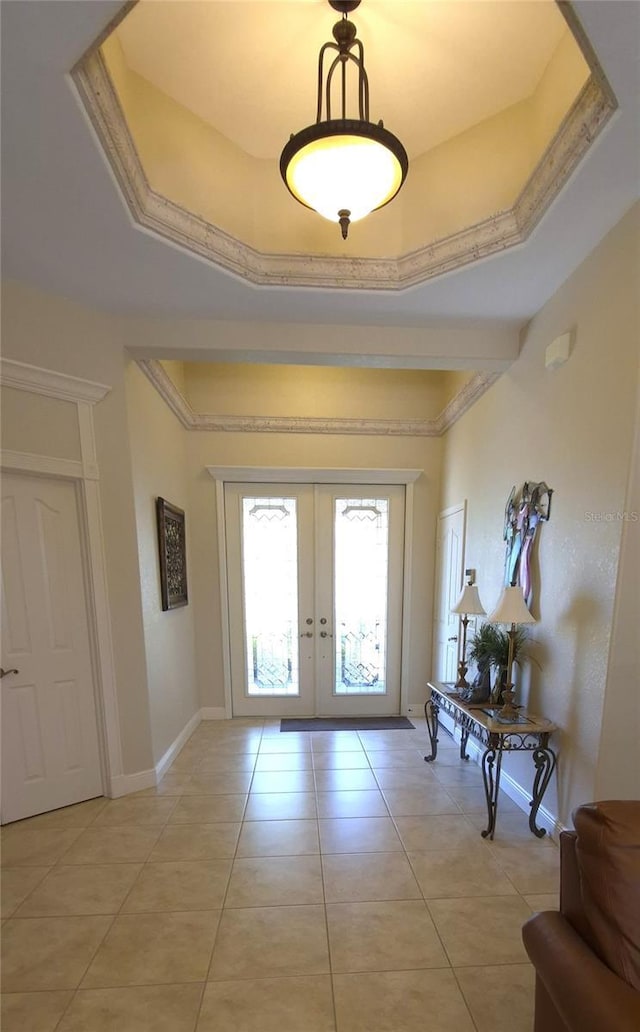 19 Medalist Way, Rotonda West, FL 33947 - doorway to outside featuring french doors, baseboards, and light tile patterned floors