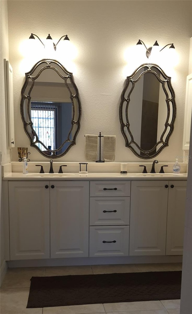 19 Medalist Way, Rotonda West, FL 33947 - bathroom with tile patterned floors and double vanity