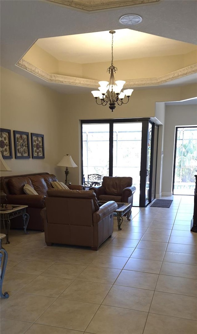 19 Medalist Way, Rotonda West, FL 33947 - living room with light tile patterned floors and a chandelier