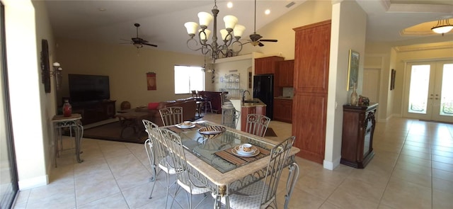 19 Medalist Way, Rotonda West, FL 33947 - dining room with ceiling fan, french doors, light tile patterned floors, a chandelier, and high vaulted ceiling