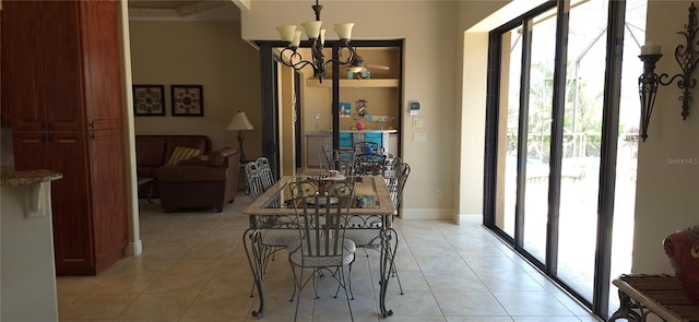 19 Medalist Way, Rotonda West, FL 33947 - dining space featuring a chandelier, light tile patterned floors, crown molding, and baseboards