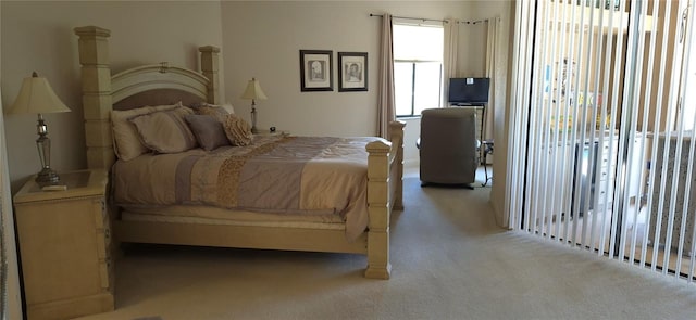 19 Medalist Way, Rotonda West, FL 33947 - bedroom featuring light carpet and access to exterior