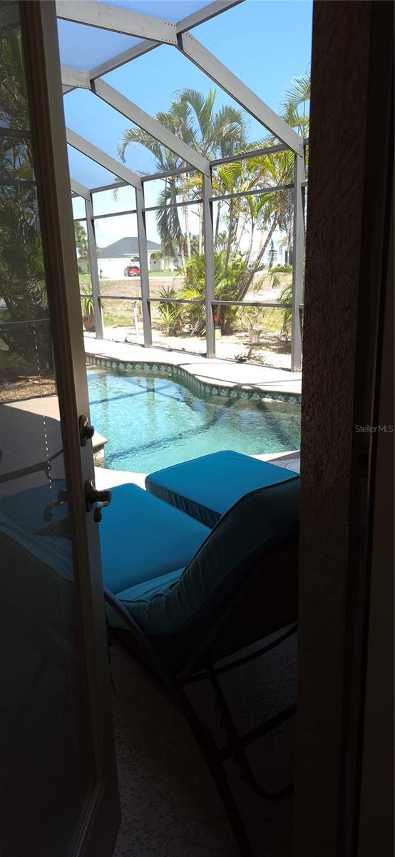 19 Medalist Way, Rotonda West, FL 33947 - outdoor pool featuring a lanai and a patio area