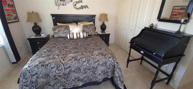 19 Medalist Way, Rotonda West, FL 33947 - bedroom with light tile patterned floors, a closet, and baseboards